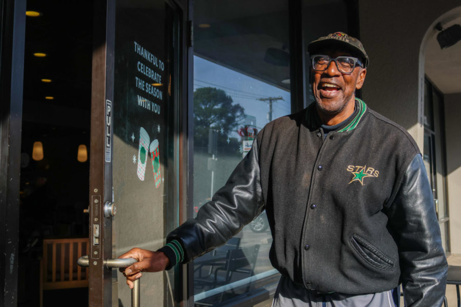 Radio personality Dewayne Dancer welcomes a guest, now a friend, into Starbucks on Nov. 18 in Arlington. Dancer catches up with regulars as he continues to welcome other customers.