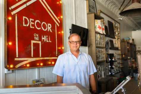 Richard Leonard, Decor on the Hill owner, began his venture in selling refinished furniture out of his home. The handmade sign has followed Leonard through his two shops.