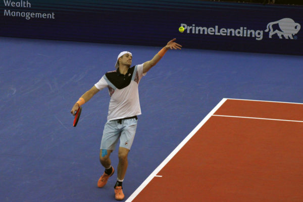 Former professional tennis player John Isner serves while competing at the Dallas Open Feb. 7, 2023, at Southern Methodist University. Isner rose to as high as a No. 8 world ranking in singles play.