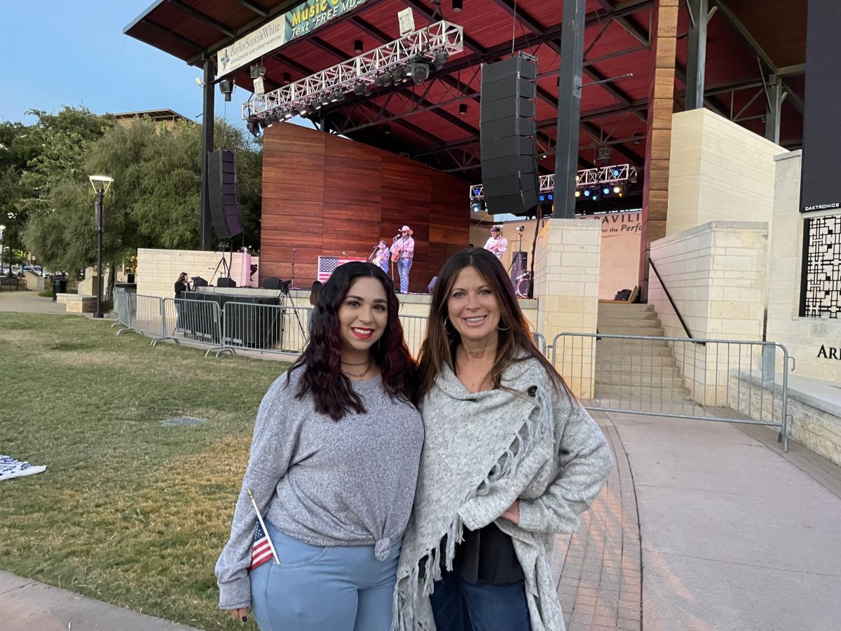 Angela Peña, left, Levitt Pavilion's communications and program development director, and Levitt Pavilion executive director Letatia Teykl, right, pose in front of the stage at a recent concert.