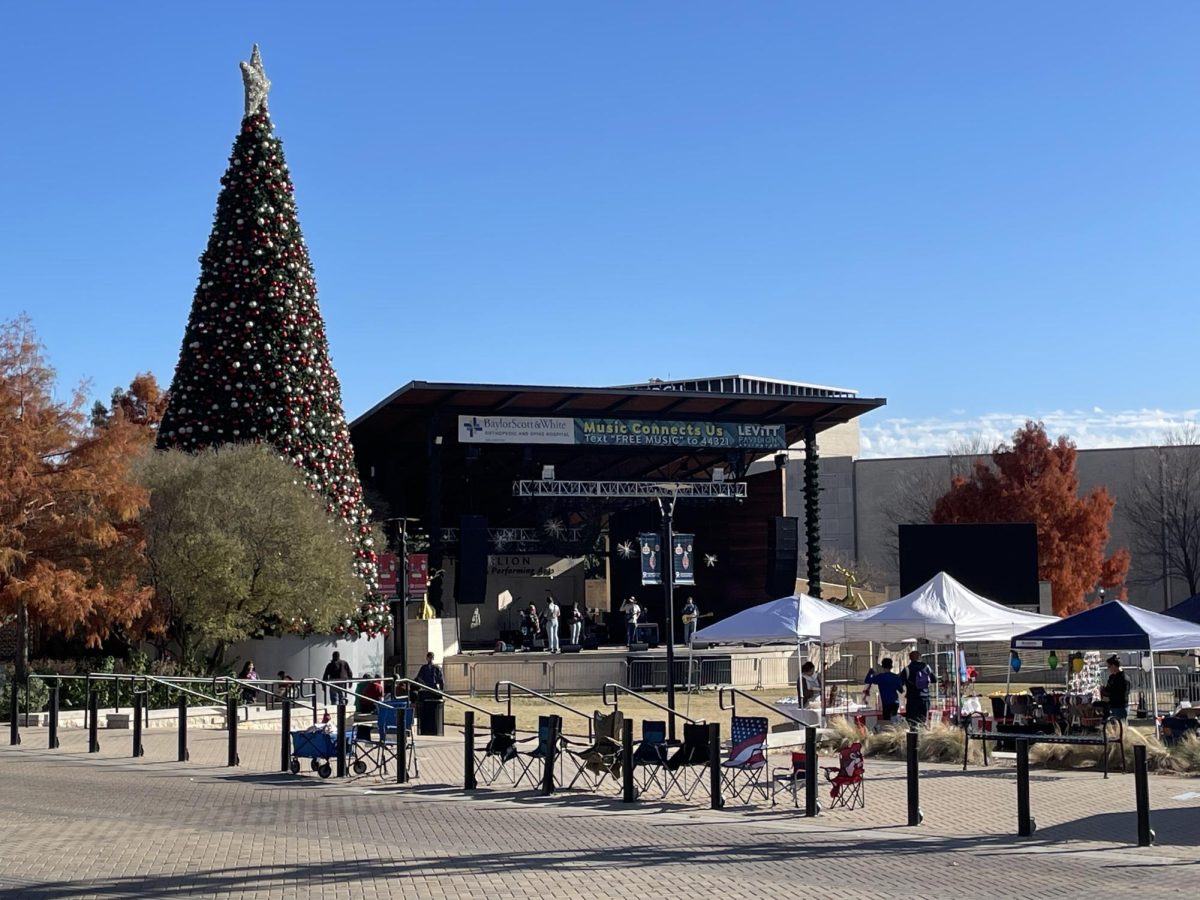 A Christmas tree frames the stage at the Levitt Pavilion in downtown Arlington during the Holiday Lights Parade event Dec. 9.