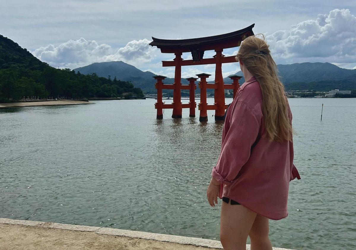 While studying abroad in Japan, Kodi Kluck learned that to become the person she was meant to be, she had to abandon her comfort zone. In this photo, Kluck admires the famous floating torii gate at Itsukushima Shrine in Miyajima, Japan. In Japanese, Miyajima translates to "shrine island."