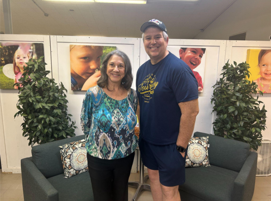 Sharon Johnston, founder of The Main Place, poses with Joe Longoria, site director.