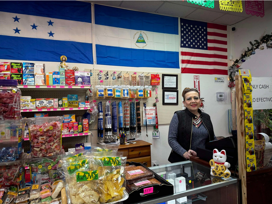 Gloria Garay, owner of Tienda Hispana San Judas, stands behind the cashier register at her East Arlington store. She said she wished the Arlington Police Department would "pay more attention to us."