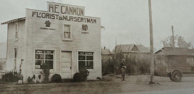 The original H.E. Cannon flower shop in what later became Arlington, Texas. Photograph of a photo on display at today's H.E. Cannon Floral.