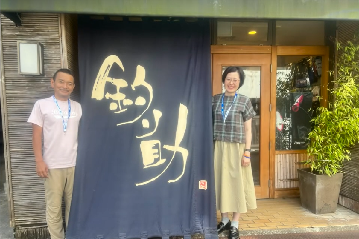 Eiichi and Kanako Koyanagi, the husband and wife owners of Tsurisuke Kawasaki, outside their tackle shop in Kawasaki, Japan.