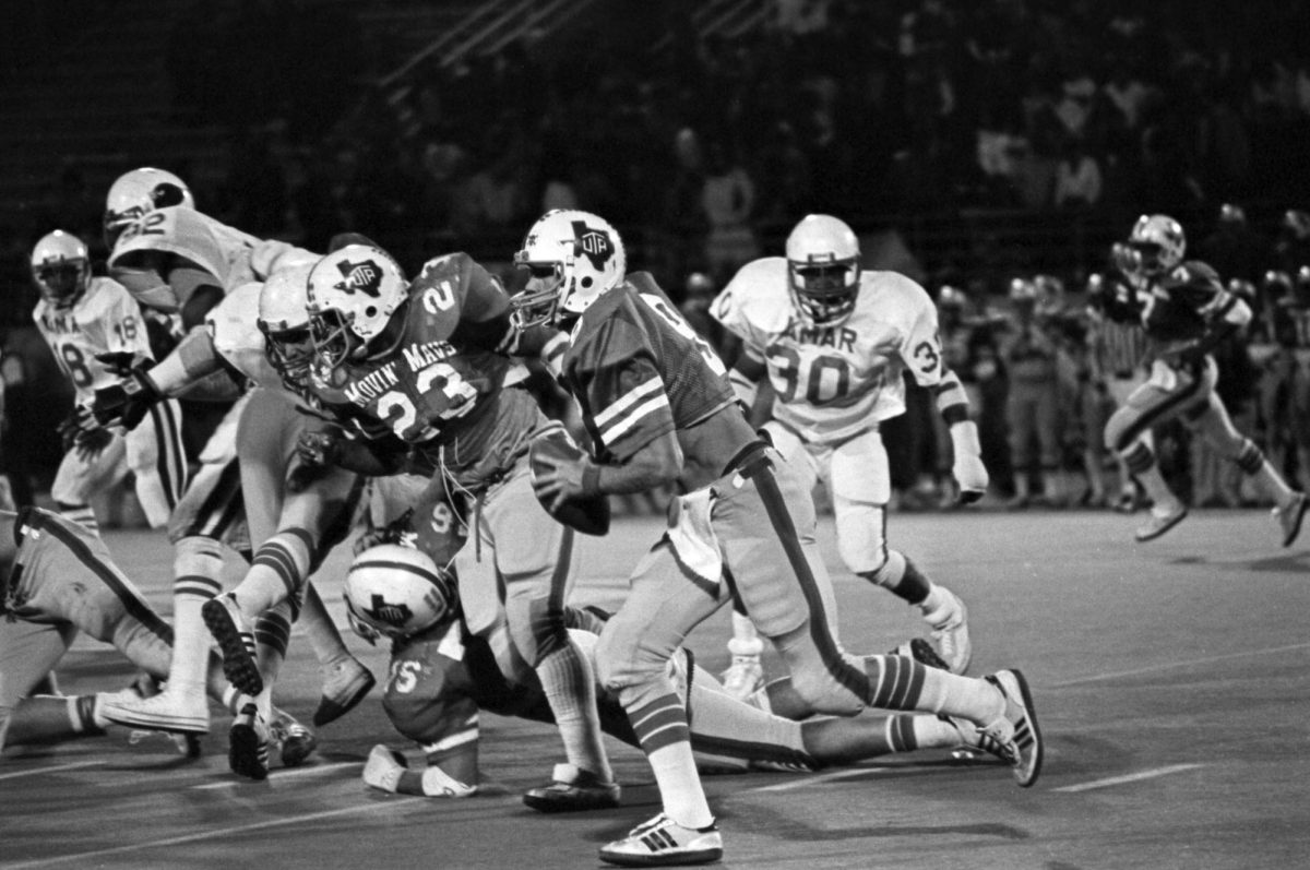University of Texas at Arlington football game against Lamar University at Maverick Stadium, Arlington, Texas. UTA Senior Quarterback Scott Logan (#9) is seen with the ball. Courtesy of University of Texas at Arlington Libraries, Special Collections. From the Arlington Citizen Journal Negative Collection.