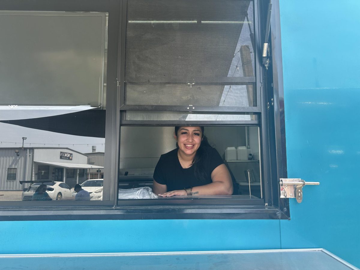 Aminta Gutierrez inside Tejas Smashburgers, one of the two food trucks she owns and operates in Arlington's Ghost Food Park.