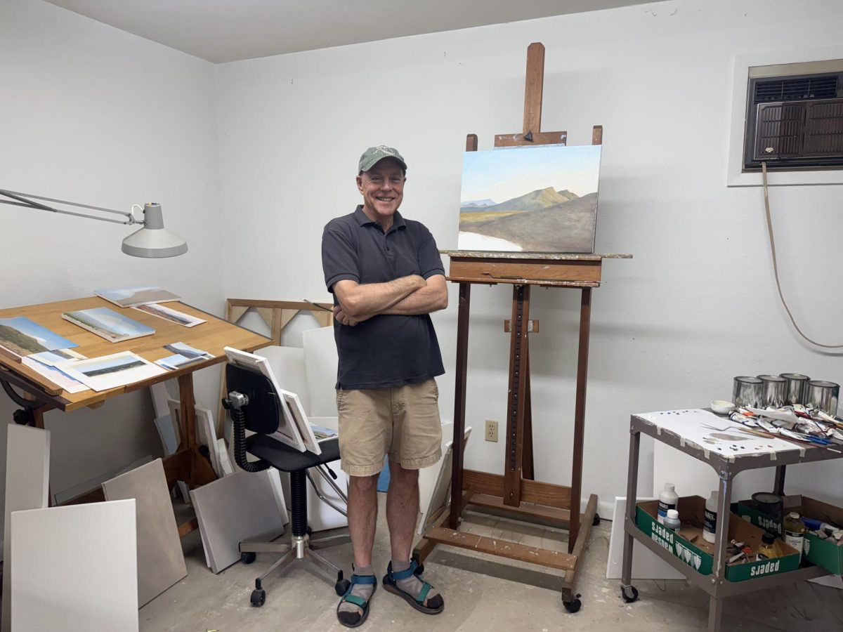 Surrounded by his work, Charlie Martin stands proudly in his studio. 