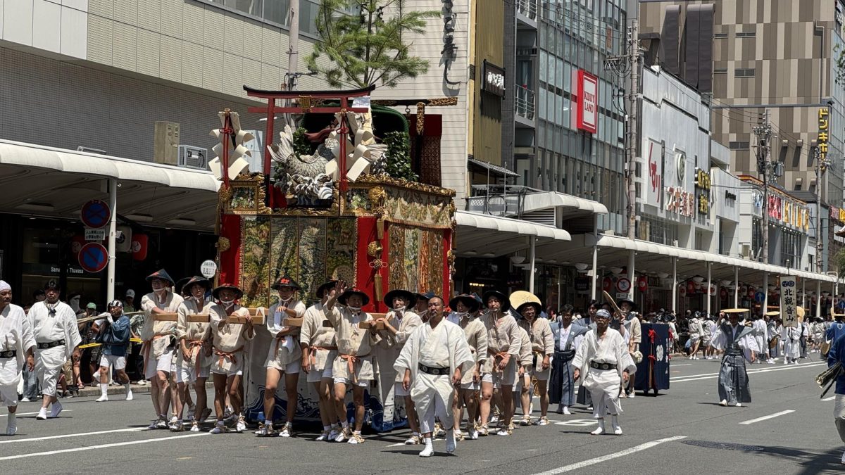 A float being pulled by dozens of men during the Gion festival in Kyoto, Japan. 