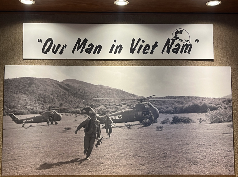 A photo from Bob Schieffer’s time in Vietnam welcoming guests as they walk into the exhibit, located in the University of Texas at Arlington Libraries Special Collections.